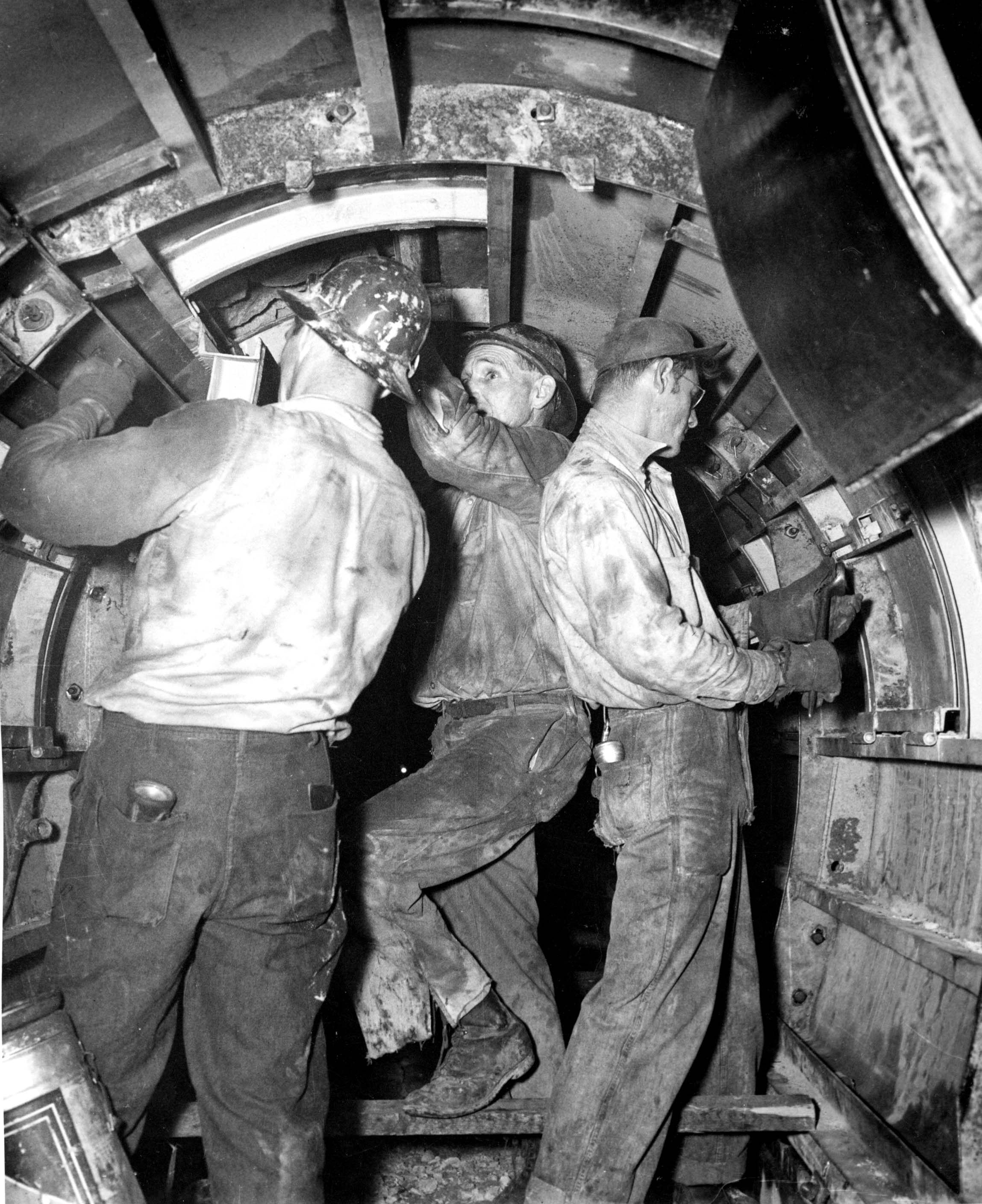 Three men inside Tunnel 1947