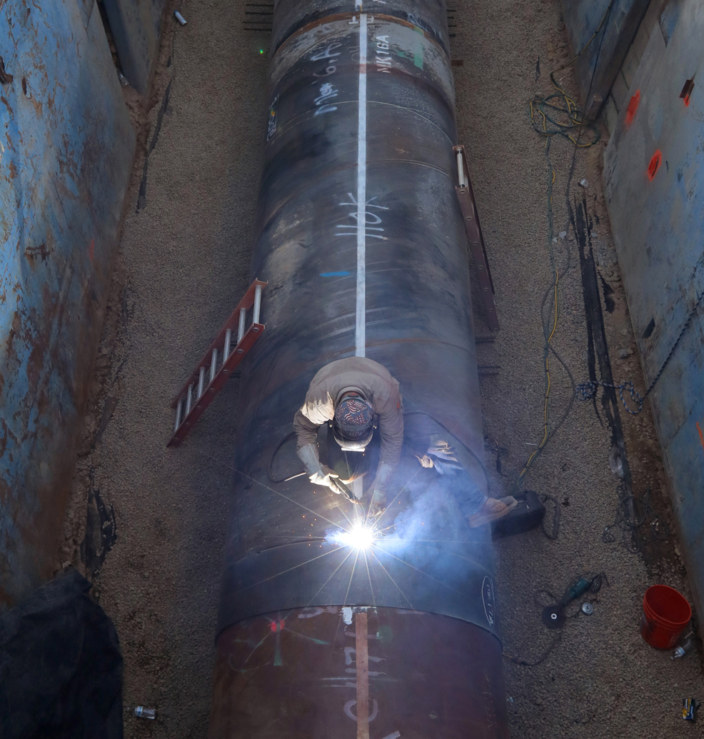 Worker welding relining tube